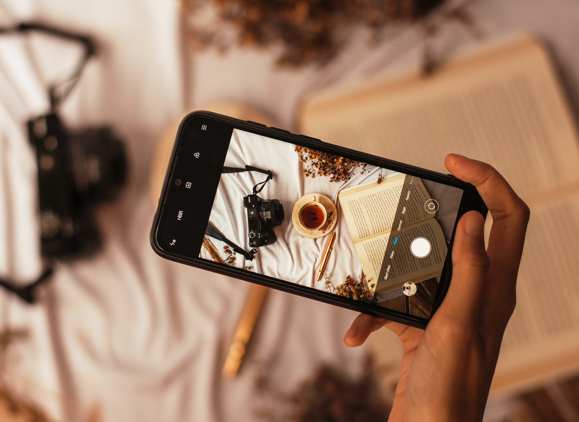 Smartphone Photographing Teacup and Book